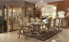 an ornate dining room set in gold and white