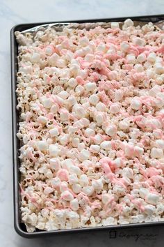 a pan filled with marshmallows sitting on top of a white countertop