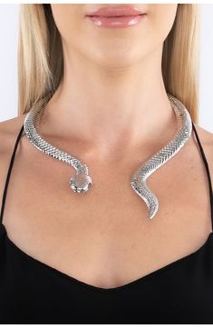 A snake shaped choker necklace adds sultry attitude to your night out looks. 10" length Hinge closure Alloy Imported Metal Choker For Night Out, Snake Chain Metal Jewelry For Parties, Silver Choker For Night Out, Party Snake Chain Metal Choker, Party Metal Snake Chain Choker, Party Jewelry: Clavicle Snake Chain, Silver Snake Necklace For Party, Silver Snake Chain Choker For Party, Trendy Snake-shaped Metal Jewelry