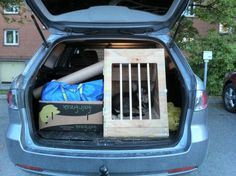 an open hatchback car trunk with items in it