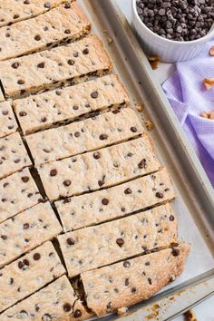 chocolate chip cookie bars cut into squares on a baking sheet