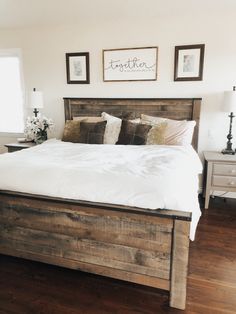 a bed with white sheets and pillows in a bedroom