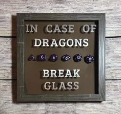 a sign that says in case of dragon's break glass with dices on it