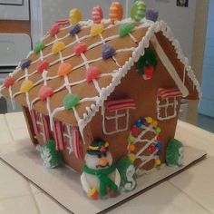 a gingerbread house decorated with candy and candies