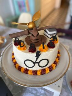 a birthday cake decorated with harry potter symbols