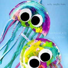 paper plate jellyfish craft for kids with googly eyes and long tentacles to make them look like they are floating in the water