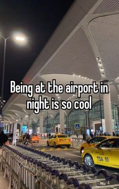 an airport with cars parked in front of it and the words being at the airport in night is so cool