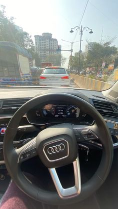 an audi car driving down the road in traffic