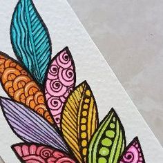 an image of a colorful flower on white paper