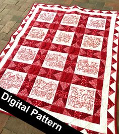 a red and white quilt with the words digital pattern on it, sitting on a brick sidewalk