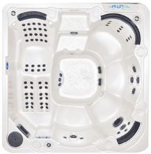 the hot tub is shown in white with black trimmings and features an automatic heater