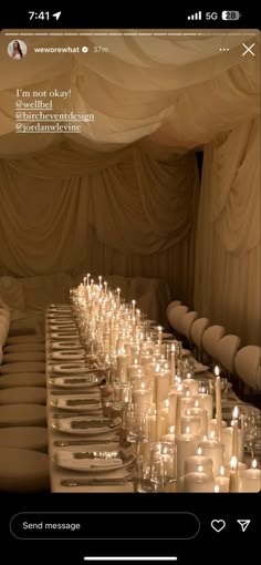 a long table with many candles on it