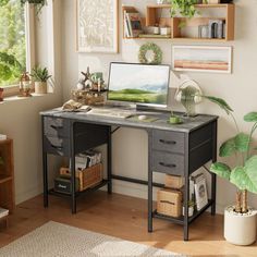 a desk with a computer on top of it in front of some potted plants