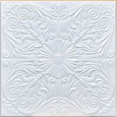 an intricately designed white tile with gold trim