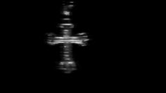 a blurry image of a cross in the dark