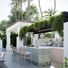 an outdoor kitchen and dining area is shown in this artist's rendering, with palm trees lining the wall