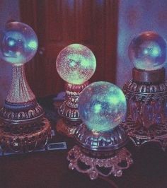 there are three glass balls sitting on top of each other