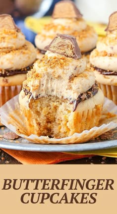 a close up of some cupcakes on a plate with the words butterfingerer cupcakes