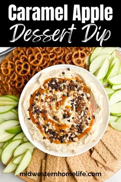 an apple dessert dip on a platter with pretzels and crackers