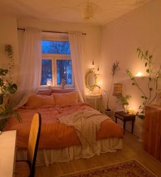 a bed room with a neatly made bed and lots of lights on the windowsill