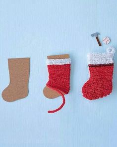 two christmas stockings and a hammer on a blue background