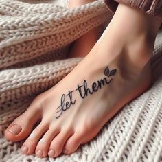 a woman's foot with the words let them tattooed on it