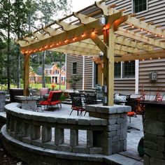 an outdoor patio with seating and lights