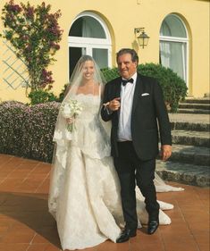 the bride and groom are walking down the steps outside their wedding ceremony venue in monteverano, italy