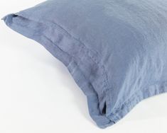 a blue pillow on a white background