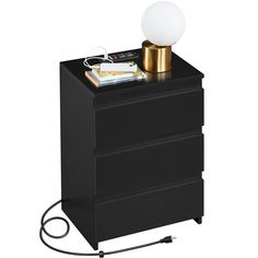 a black night stand with a white light on top