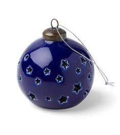 a blue glass ornament with stars on it