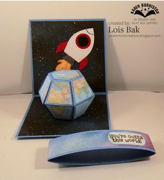 a pop up card with a rocket ship on it