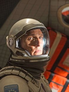 a man wearing a space suit and helmet