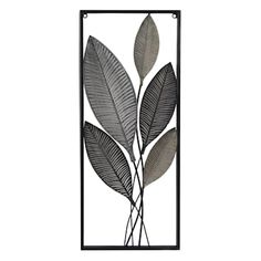 a metal wall hanging with leaves on it