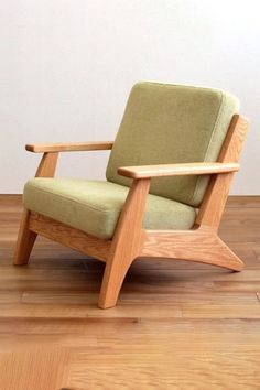 a wooden chair sitting on top of a hard wood floor