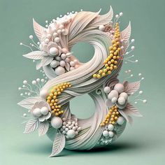 the letter s is made up of white and yellow flowers, leaves, and beads