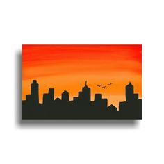 an orange and black cityscape with birds flying in the sky