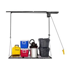 an overhead hanging pot rack with various storage containers and tools on the bottom, along with other items