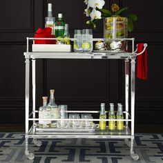 the instagram page shows an image of a bar cart with bottles on it