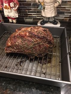 a roasting rack with some meat on it