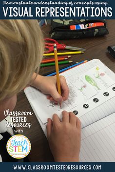 a child is writing on a notebook with colored pencils