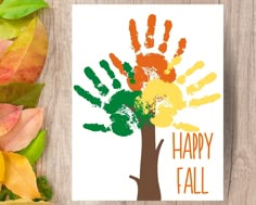 a card with the words happy fall written on it next to autumn leaves and a tree