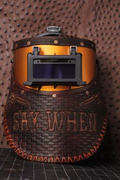 Welding mask, 100% customizable, Add names colors. Anything If you are interested in getting your very own welding mask, message me for custom work , Fully customizable and 1 of a kind, 100% leather , Isn't made with a press, it's handcrafted to insure the highest quality, and ensures personalization 🙌🏽 If you have a mask in mind and have yet to find one that describes your personality I am here to help you create your very own mask. Feel free to message me with your ideas The shield is a suga Welding Mask, Welding Hoods, Welding Rig, Describe Your Personality, Describe Yourself, Custom Leather, Gift Shop, Sell On Etsy, Mask