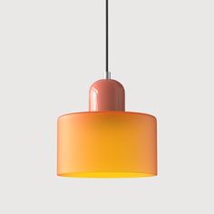 an orange and pink light hanging from a ceiling