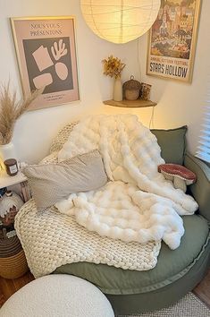 a living room filled with lots of furniture and pillows on top of a green couch