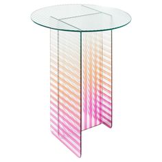 a round glass table with pink and orange stripes on the top, against a white background