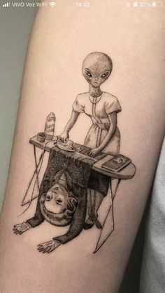 an alien is sitting at a desk with a monkey on it's leg and another creature in the background