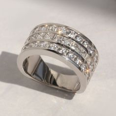 a diamond ring is shown on a white surface