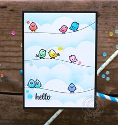 a card with birds sitting on a wire