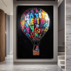 a balloon with the words happy birthday painted on it is in front of a staircase